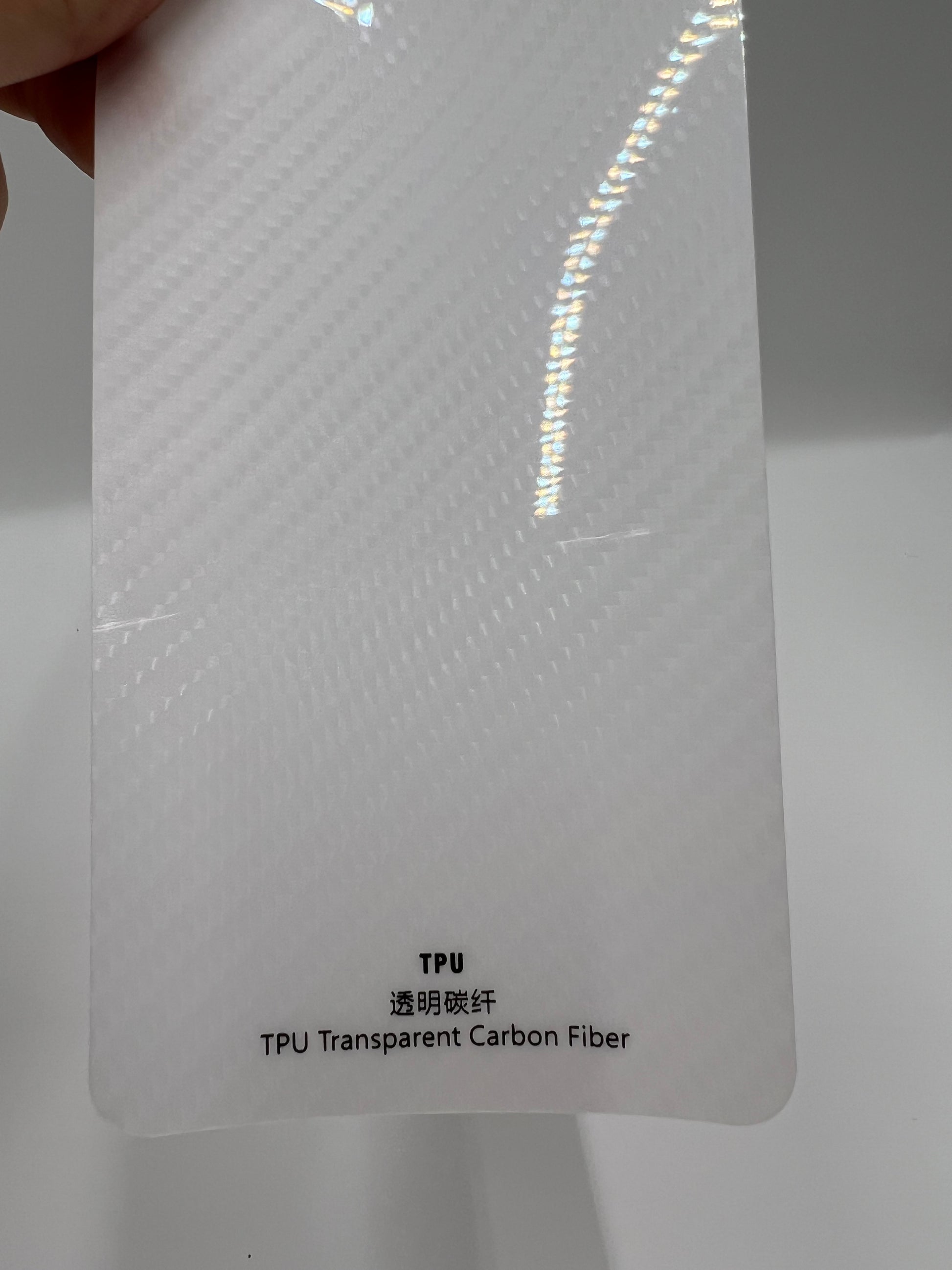Close-up of clear TPU carbon fiber texture wrap film