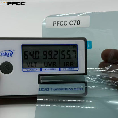 Carbon series heat rejection film roll on white background