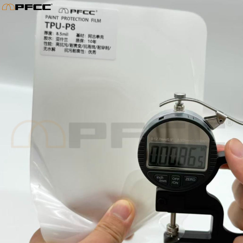 Transparent automotive film protecting luxury sedan